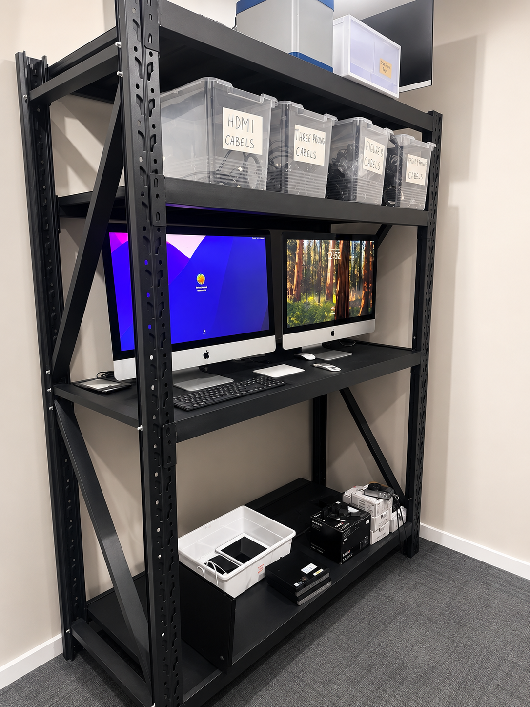 Refurbished iMacs and organised cable storage ready for resale
