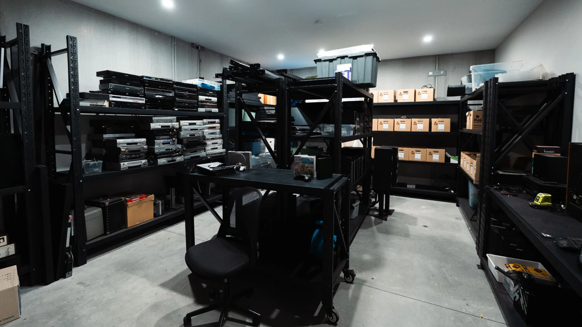 Wide view of our Penrith warehouse, showing electronics, equipment and storage shelving